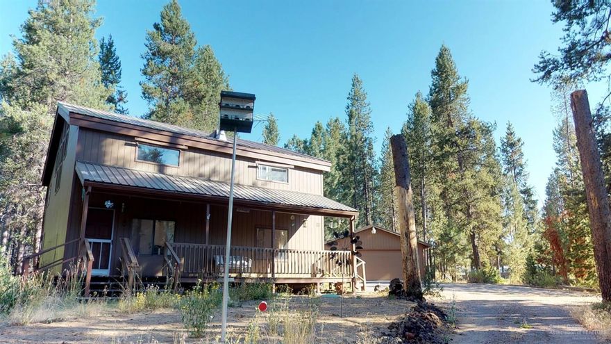 Come home to your cabin nestled in the woods. Custom built 3 bed 2 bath home featuring barn door accents, open kitchen, spacious living area & generous natural light throughout. Covered RV parking, large heated garage w/ workbench & ample storage. Secluded location situated on an acre with garden area & many outdoor spaces to entertain. Come & see your piece of paradise. Fantastic location close to State Rec Park, Sunriver & all Central Oregon has to offer! See attached 3-D virtual tour.