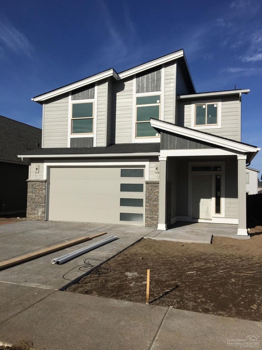 Spacious Benjamin floorplan has a very unique design and the quality construction you expect from Pahlisch Homes. One bedroom & full bathroom on main level, great room concept, loft, and large master suite with freestanding soaker tub in master bath. Quartz counter tops in kitchen and bathrooms, luxury vinyl plank flooring and large covered back patio. As in all Pahlisch Homes, well-crafted finishes are used throughout. Triple Ridge is a quality neighborhood located close to Ridgeview High School. Let the HOA care for your front yard and enjoy summers in your community swimming pool! Come see why Pahlisch has won 150+ Quality & Value Awards! Photos of similar home, specs vary.   Home is yet to start.  Choose all features from the ground up!  Spring 2020 estimated completion.  Please visit our model home at 3622 SW Coyote Lane open Wed-Sun from 12-5.