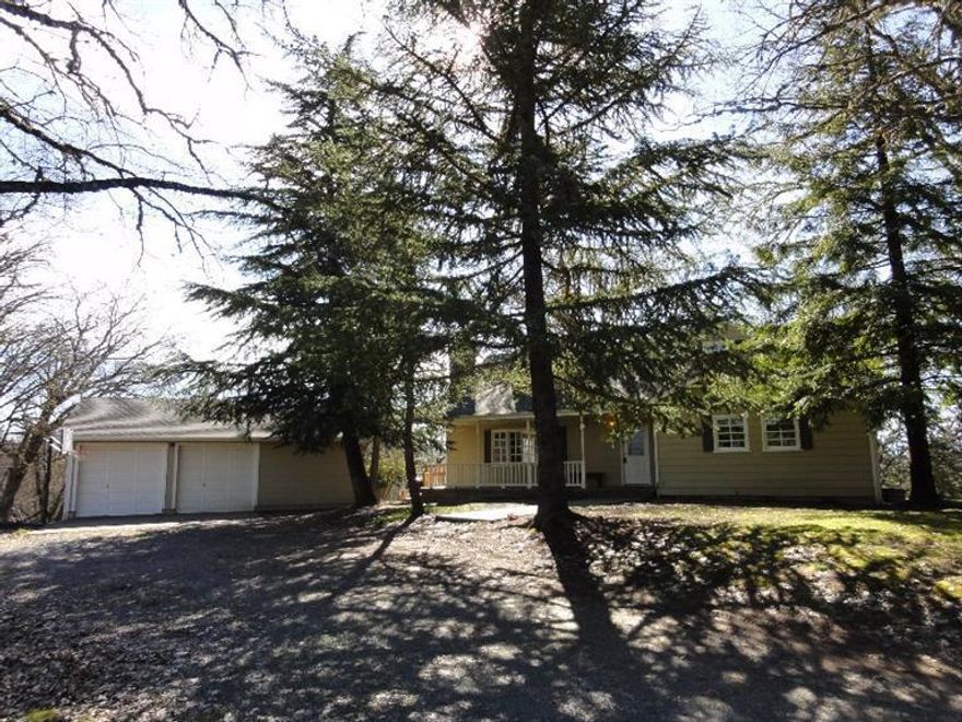 This is a unique property out in the North Valley area of Grants Pass with rolling hills, pastures, and the country farm home on the knoll. This is a solid built 4 bedroom 2 bath home. The 10.34 acres has areas of animal fencing with pasture options, there is an animal pen, and recent installed fenced garden area. Don't miss the opportunity to enjoy the views of the sunrises and sunsets from the porch while watching the wildlife.