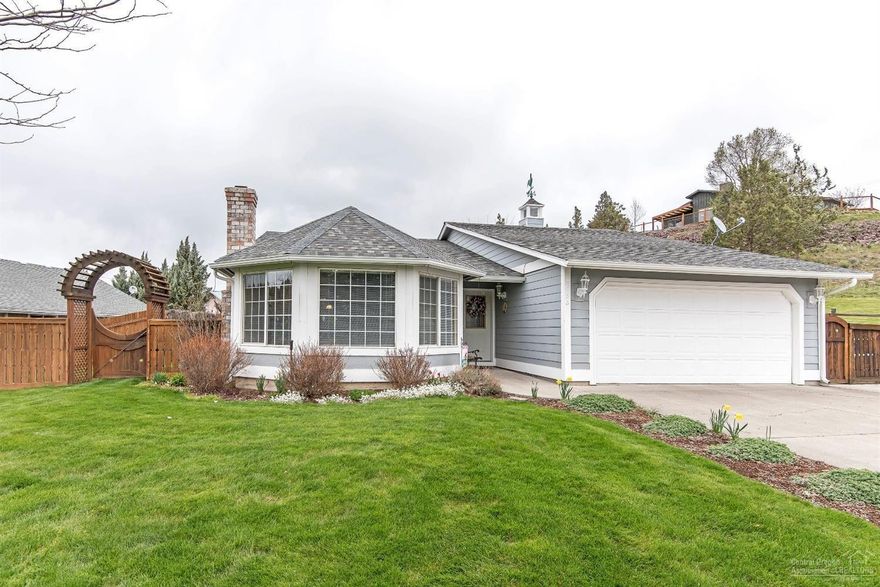 Private, park-like setting, pristine updated 3BD, 2BA home w/bay window & fireplace in the formal living room & woodstove in the family room - move-in ready! Garden arbor, beautiful landscaping & pergola on back patio-perfect place to entertain or enjoy peace & quiet. Attached 2-car garage PLUS detached insulated 3-bay shop on 1Ac w/.50 acre of irrigation & filtered pump, bordering canal. Greenhouse, RV Parking w/30 amp plug & room for lots of toys. Still time to make this gem yours for the summer!