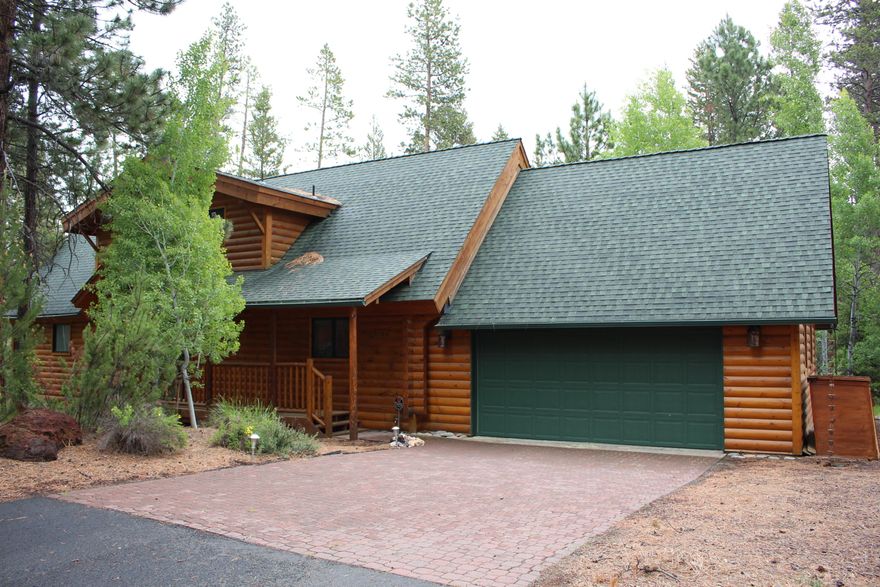 This beautiful log home is in great condition and has been a true second home for the sellers who had the home built by Stanley Custom Log Homes in 2005. The sellers have done a terrific job in taking care of the property and it shows. There are three bedrooms, a nice size loft, a wonderful game room above the garage, two and half bathrooms, propane fireplace in the master bedroom and wood burning fireplace with a Redwood mantle in the living room, heated floors in the master bath, some great interior finish work, Maple hardwood floors and wonderful beams comprising 2,686 square feet with an over sized attached double car garage. The home was built on two lots allowing for a nice deck area hosting a comfortable hot tub for your enjoyment. There is ample common ground on the east side of the home while the bike/walking path and US Forest Service land are located to the north side. The furnishings will remain and they include a 1898 antique piano that was relocated to Oregon from Ohio.