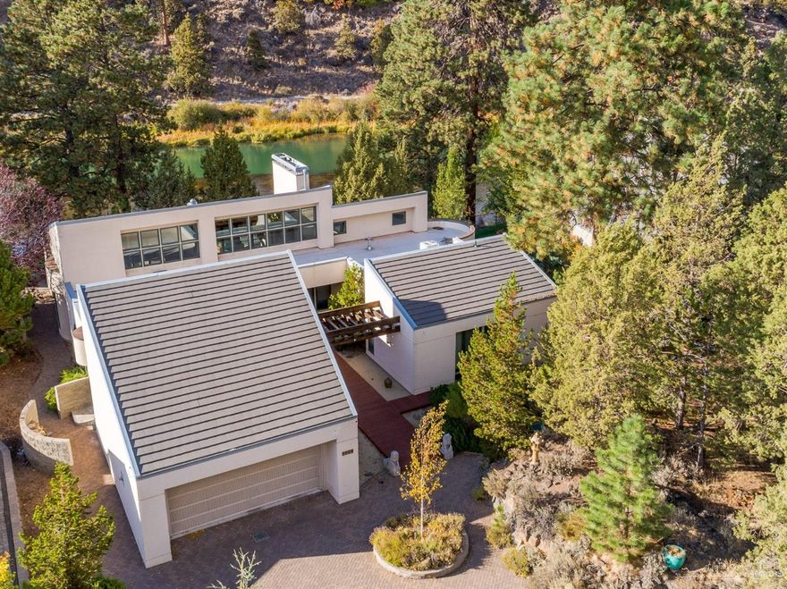 Unmatched waterfront setting on the Deschutes River in the heart of Bend close to down town. Beautiful comtemporary arcitechure on a large .83 acre lot makes for an upmatched setting. Large teak deck and paver patio overlooking the river. One story living with chef's kitchen and large open great room. Master bedroom has views of the river with a beautiful master bathroom including jetted tub and large tiled walk-in shower. All three bedrooms have private outdoor patios. Built in Vac system with ample storage throughout the home. Less than a mile from down town.