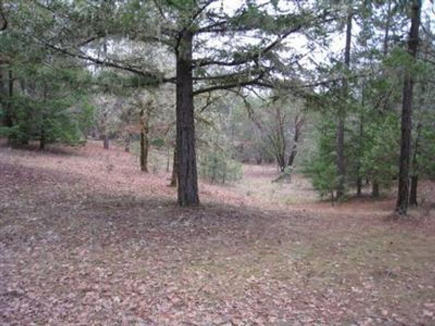 BEAUTIFUL, Wooded 5.37 Acre Parcel with cleared homesite. Homesite is elevated with a great view of distant mountains. Standard Septic site approval per owner. Adjacent property well recorded at 35 gpm - 140' deep when drilled. Information may be subject to change.