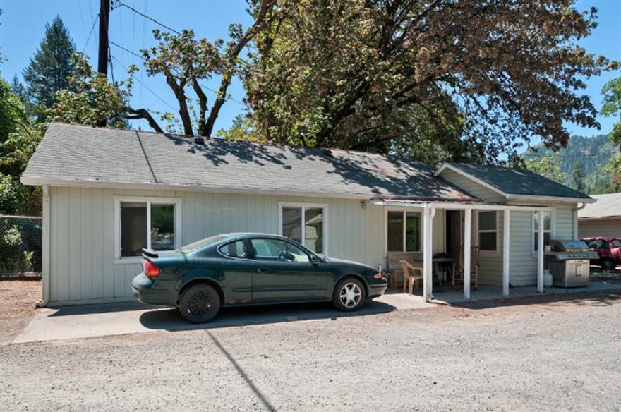 Great investment, well maintained, cute duplexes (two small separate homes) with good rental history. Small fenced yard with huge shade tree. One car garage, new septic system, each unit has two bedrooms, nice size kitchens and large living rooms. Located on Rogue River Hwy.