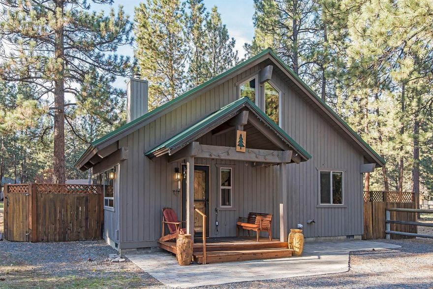 Charming Cabin on half-acre lot with inviting open floor plan, high beamed pine ceilings, a cozy wood stove, and a bedroom and bath on both floors. There's lots of outdoor entertaining areas; new decks, paver patios, fire pit, and outdoor shower. The home has been recently renovated with NEW appliances, kitchen counters, sink, new heat pump, duct work, carpet, showers, windows, and blinds. Fresh paint inside and out. Included are a complete set of engineered plans for a double garage with a second floor!