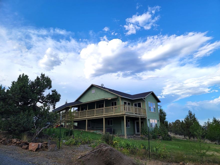 This a MUST See 3 story home with land that is Perfect for those looking for ROOM TO BREATHE. Country living at its Best with Panoramic Mountain and Valley views with tons of PRIVACY on a 4.22acres. Don't miss out on this spacious 3554 sqft home that is set up for Multi-Family living with its 4 bedrooms, 3 1/2 baths, PLUS an office for those who work from home, a completely finished bonus room over the 2 car garage, and yet still has more with a fully finished daylight basement with a separate exterior entrance! Master bedroom is on the main level with a Jacuzzi tub, walk-in tile shower, walk-in closet and a private deck overlooking the amazing valley view. This home also sports a Jack and Jill bed/bath plan. Enjoy your evenings on the wrap around porch to watch the amazing sunrise and sunsets. A dreamy amount of storage with an extra large pantry off the kitchen, and cold storage perfect for a wine Cellar. Open floor plan gives plenty of room to move. Bring your horses, toys, & garden