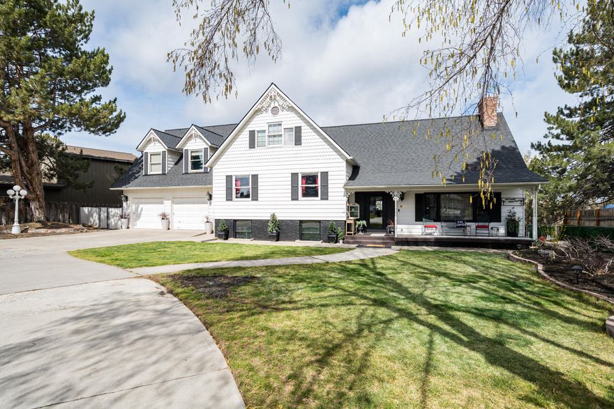 This stunning country Victorian-style home is truly one of a kind in a stellar location right on Dry Canyon in the heart of Redmond. Walk-in & you'll notice the gorgeous woodwork throughout. Living room offers a stunning full brick wall with a gas FP. The kitchen has been extensively remodeled with Café™ appliances, butcherblock counters, spacious walk-in pantry, & French doors out to the dining sunroom. Your backyard transitions into canyon trails & parks & gives you the option for RV or toy parking. Bougie chicken coop included. Basement includes media room, hidden closet, screen, bedroom, half bath, & laundry room. Mid level includes 2 large bedrooms, one with ensuite, & full bath in hall. Primary suite is beyond spacious with vaulted ceilings, amazing mt views, & 2 story walk-in closet with org system. Large newly renovated primary bathroom includes a full steam shower & soaking tub. Lastly, a good sized office. Minutes away from breweries, shops, schools, & so much more! New roof!