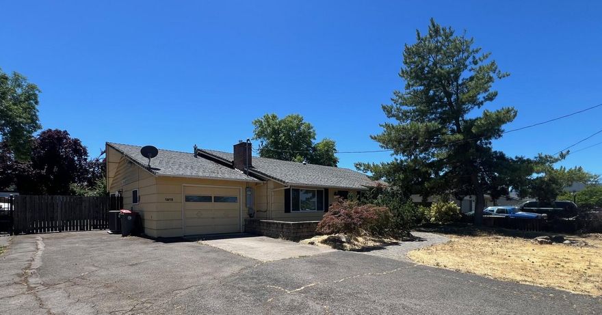 Incredible opportunity to aesthetically transform a spacious 4 bed, 2 full bath home w/over 1800 sq ft of living space, RV parking and in-ground pool in East Medford and make it into your dream home! The original 3 bedrooms, dining and family areas all have beautiful hardwood floors, and the addition boasts a huge living room and primary bedroom with dual closets and bathroom. You get a fantastic sunroom as an added bonus with a bay window overlooking the beautiful in-ground pool, along with a huge laundry area just off the kitchen w/a pantry, tons of storage and built-in desk!  Almost all kitchen appliances are only 2 years old and both the kitchen and guest bathroom offer solar tubes allowing for lots of natural light. This property has great bones and is just waiting for someone to make her shine again!