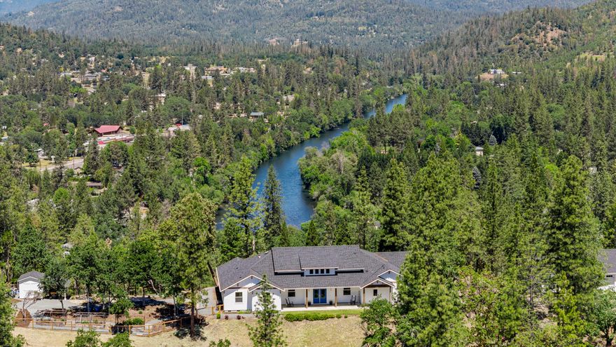 Absolutely stunning Michael Susi quality built home on 15 private acres with panoramic mountain and Rogue River views, minutes from town. This 4 bed + Office 3101 sf home is the epitome of luxury with quality contemporary finishes throughout.  Master En-Suite features His and Her private vanities, built in steam sauna, soaking tub, beautiful tiled shower, oversized luxury closet and laundry room exactly where it makes sense.    Gorgeous open kitchen with plenty of storage, island with prep sink,  private butler's pantry with prep sink, secondary fridge and more.  Outside is a finished 3 car garage with attached Legal ADU, currently used as a gym with it's on private bathroom. (kitchen and flooring needed to finish to use as living facilities).  Enjoy the peace and quiet on your covered back patio with outdoor entertainment area featuring linear fireplace , TV and fans, koi pond, fenced garden areas, park like setting with your own hiking trails and more.  All this AND Amazing Internet