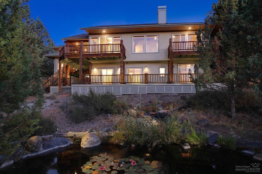 Picturesque lodge style retreat in Wyndemere. 180 degree Cascade mountain views. Immaculately maintained home with new carpet, new paint, new dishwasher & stainless appliances. 1400 SF decking to enjoy the water feature/pond and sprawling views. Custom light fixtures throughout, finished basement, heated triple car garage, recirculating hot water and new hot water heater. Nearly one acre natural landscaped lot borders the Bend River Trail. Enjoy the privacy and tranquility of this beautiful NW Bend Gem!