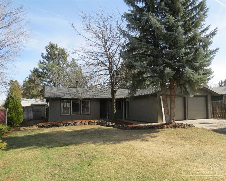 Located on a large .20acre lot with an abundance of mature trees surrounding the home. Lots of landscaping and shrubs--home sits back on the lot for tons of parking. 3 bedroom, 2 bath home with huge kitchen and dining area, all open for ease of entertainment. Master with full bath, includes pellet stove in living room, all new stainless steel appliances including microwave, refrigerator, range/oven and dishwasher. New roof, cadet heaters and garage doors. Large double attached garage. Vacant & ready to go.