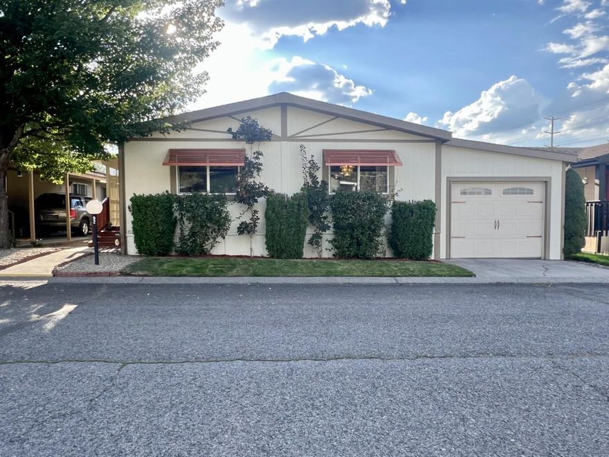 Welcome to easy living in the heart of Bend's desirable Suntree Village - a friendly, well-maintained 55+ community with convenience and privacy.  This turn-key beautifully maintained home offers a warm open-concept layout with updated features throughout.  Spacious living with vaulted ceiling.  Bright kitchen with skylight, ample cabinet space and open eating area. 
Primary suite with ensuite bath and walk-in closet. Updated TRANE HVAC system, & vinyl windows.
Private fenced back yard with patio area - perfect for relaxing, entertaining or gardening. Covered and enclosed deep carport. Finished garage workshop area with 2 tool benches and flexible space. On-site management.  Monthly rent space includes-water, sewer, garbage, sprinkler maintenance, clubhouse and snow plow. 
Close to shopping, dining, senior center, Larkspur community center, walking trail and highway access. Owner occupied only, no sublease. All occupants must have park approval