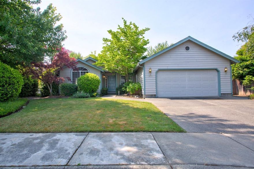 Here is a fantastic place to call home, having an open floor plan with 3 bedrooms, 2 bathrooms. The master bedroom opens out into the backyard and a walk-in closet off the bath is spacious. The sunny breakfast nook looks out into a lush yard with privacy, mature trees and landscaping. The kitchen opens into the family room allowing for all kinds of comfortable entertaining and it opens onto the outdoor patio with pergola. This home is close to all of the local amenities Grants Pass has to offer and is near the Reinhart All-Sports Park.