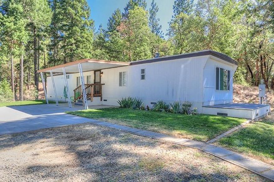 VACANT and TURN-KEY for the most discriminating buyer and OWNER WANTS TO CARRY the note - 5.40 rolling, wooded, sunny Southwestern facing acres with a 100 g.p.m. well, per log; and an incredibly clean and remodeled 2 bedroom, 1.5 bath home that includes an office (potential 3rd bedroom) in a very private setting on desirable Sleepy Hollow Loop. Enjoy spectacular 180 degree views, wildlife including red tail hawk, deer and fox and superb peace and quiet. Recent fresh paint, shampooed carpet, new vinyl, even some brand new windows and refinished cabinetry in addition to the fact that the home has been completely overhauled several years ago with new: roof, double pane vinyl windows, carpet, vinyl, cabinetry, counter tops, forced heating and air, drywall, fixtures, appliances (range/oven, d/w, fridge), high rise toilets, shower enclosure, covered and uncovered concrete patio, and a trex deck! It get's better you may have the opportunity to purchase the adjacent 5 acres (improved w/ 18 gpm