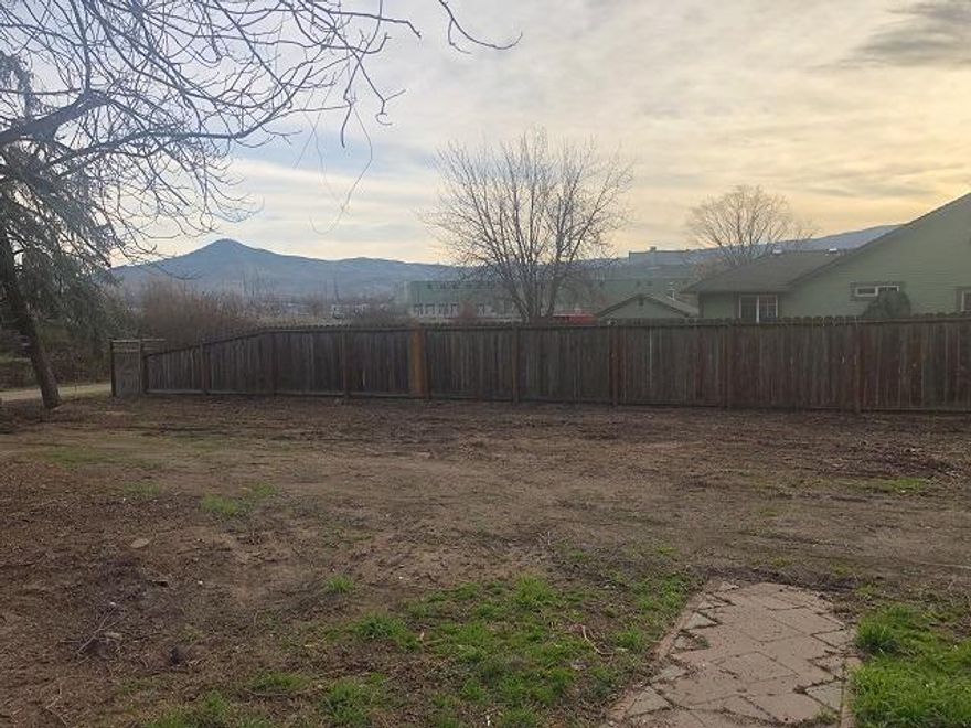 Big .22 acre lot to build on. Current structure is 1486 sqft and was built in 1953 with 3 bedrooms and 2 bathrooms, but due to extreme neglect home has little to no value. No appliances or fixtures remain. City water. Septic in. Not eligible for financing, so cash offers only.