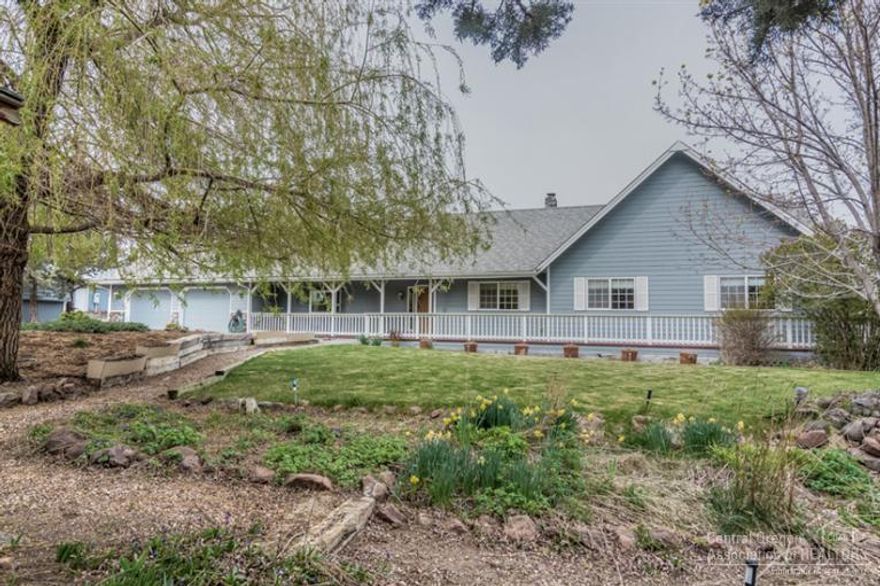 Large single level 3bed/2.5bath home. Centrally located in quiet neighborhood. This custom home is truly pride of ownership. Complete wrap around porch with large overhangs. Just under 3000sf shop with every bell & whistle. Completely insulated with heating system & half bath. Outside fenced storage area with another pole building perfect for all of your toys. Home has open beams and vaulted ceilings that are breathtaking and it is perfect for entertaining large groups or small.