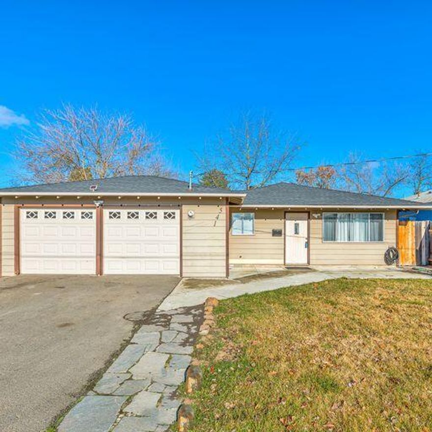 Charming ranch style home conveniently located to shopping, schools and parks. This home features 3bed 1bath and it is move in ready with laminated flooring throughout that makes this home feel so much larger.  Directly accross the street there is a community park  with a playground, skate park, and soccer field and only one block from Central Point Elementary School.  Schedule your personal tour today!