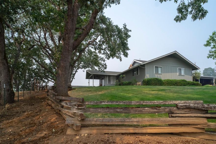 Beautiful country setting, views of Mt. McLoughlin & Roxy Ann from your living room window. Nestled in shade trees, paved gated entry, located minutes to downtown Medford. Solidly built home is 3000 sq. ft. could use some updating, yet has endless possibilities. Could be a two family set up, as it features two master bedroom suites, one on main level, and 2nd bdrm upstairs. Kitchen is open, with both formal & informal dining areas, wet bar, sunken living room, and large utility with full bath. Inground swimming pool, 2 car garage, 3 car carport, and lots of recreational & RV parking! Property has white rail fencing, room for horses, or animals. Home is located across the street from a large ranch with rolling fields of green pastures.