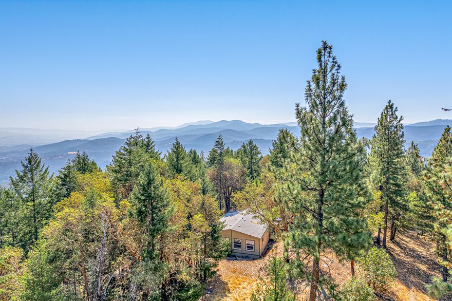 Ever dreamed of owning a piece of history within Southern Oregon? If so, this is the one for you! Between the late 1800's-early 1900's, this 54+ acre parcel was one of the largest gold mines in the state of Oregon! Per the seller, Gold is still located within the property and tons of mining tunnels run throughout the property. No power, but there is an older manufactured home that needs work, with a septic on the property. 500 gallon holding tank on the property is hooked up to a ram pump that goes 200 ft down into an old mining shaft. Property to be sold AS-IS. Accessible via 4-wheel drive and extremely private. Within 10 minutes from Downtown Jacksonville, you can remodel the current home, make it a hunters getaway, and/or continue mining for gold... The possibilities are endless with this one! Appt only, so contact your agent today for a personal tour, before it's too late!