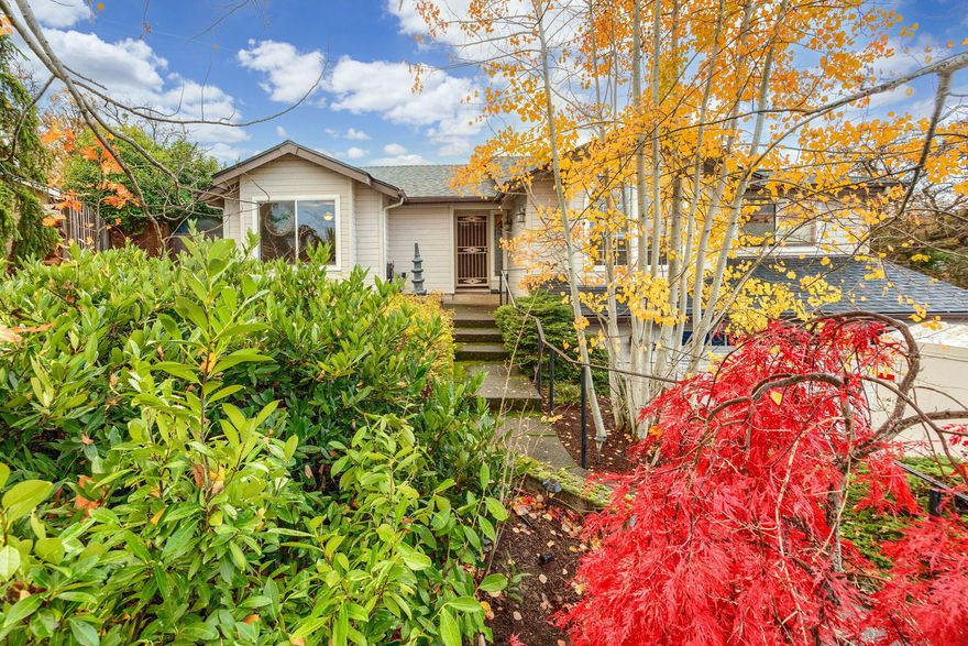 Inviting home on a quiet cul-de-sac with stunning mountain views and a beautifully landscaped lot! This well-maintained property offers everything you need on the main level, including a spacious kitchen with an eating bar and a cozy living room with a fireplace. The primary bedroom features a walk-in closet and a full bath. Enjoy the ease of new laminate flooring throughout and a bonus room or home office with a half bath on the lower level. The private backyard is fully fenced, with raised garden beds, mature trees, a covered deck, stone patio with a firepit, and a soothing water feature. Property backs up to Oak Knoll Open Space. Additional highlights include a new roof (2015), RV parking, workshop, and garden shed. Convenient attached double-car garage completes this wonderful property!