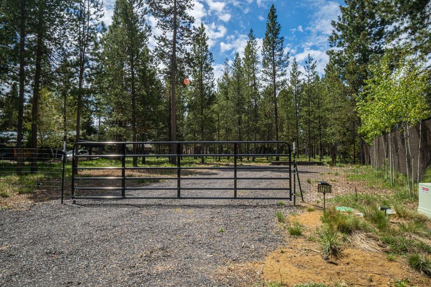 OWW2 fenced and gated property ready for your immediate basecamp! Power and water are on the property. Located only one block from the OWW2 private boat ramp with access to the Deschutes River. This property has been improved with RV hook up to power and water all on a gravel parking pad just beyond the gated entrance. Build your dream home or keep it just as it is! Imagine just the ease of walking with your favorite inflatable to the Deschutes River in minutes! This is a community with paved roads and access to trails. Located a short distance to the Cascade Lakes Hwy and 20 minutes south of Bend.