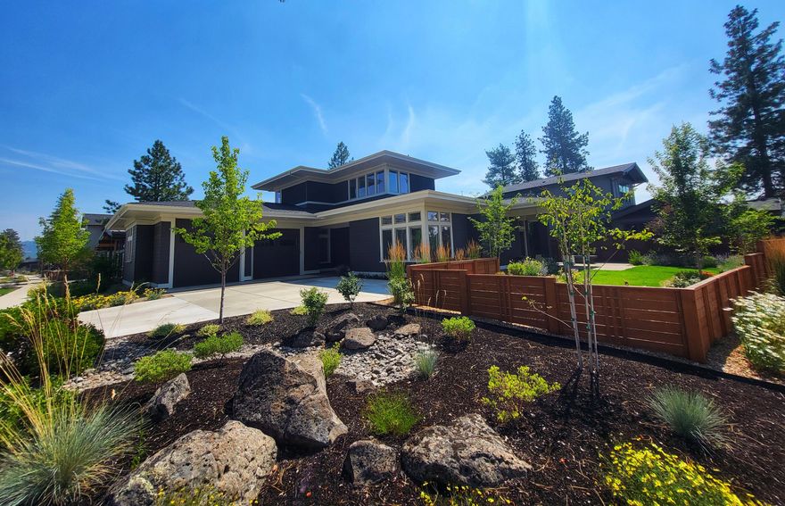 Discovery West on Bend's west side is perched above Northwest Crossing. Convenient to excellent schools, shopping, eateries, wine tasting, pubs & trails. Phil's trail system & more, literally right outside your door! Easy access to Mt. Bachelor &  adventures! Greg Welch, Earth Advantage build, completed 2022 is lightly lived in, shows like new with an outstanding floor plan & finishes. Main level owner's suite w/heated tile floors in spa-like bath & big walk-in closet. Main level office, great room w/gas fireplace, high ceilings, abundant windows for a light & airy, yet warm & inviting space. The kitchen is a chef's dream with a big center island, loads of solid quartz countertops, Dacor appliances & walk-in pantry.2 bedrooms & bonus room up. Epic sunsets from the covered patio w/gas firepit & gas BBQ hook-up. Terrific fenced yard w/lush landscape. 2 car garage w/ 10' door, epoxy floor, EV charger & storage system round out the perfection