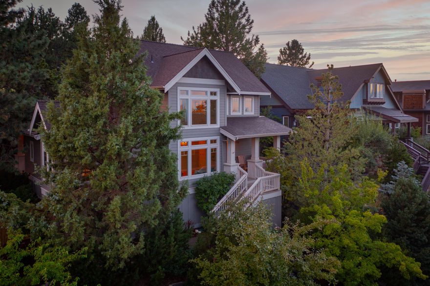 Welcome home to Awbrey Village! This quiet street is perfect for relaxing, spreading out, and soaking in the views. Whether you prefer chilling on the front porch or entertaining on the expansive back patio - this craftsman-style home offers warm and inviting areas both inside and out. You'll cozy up to the fireplace in the morning and gather around the kitchen island until the night's end. Rich hardwood flooring runs consistently through the main level and into the primary bedroom suite and its bonus sitting area and walk-in closet. The spacious upstairs bedroom wing features new carpet, massive ceilings, and privacy from the rest of the property. It's rare to find a yard in this neighborhood, but finding one so open and carefully landscaped is a dream come true. Park your vehicles and store your toys in the heated 3-car garage. This home is just a few minutes from the Deschutes River Trail. You're going to love living here!