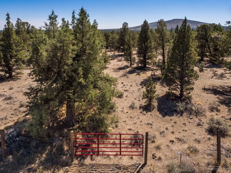 Terrific location between Redmond and Sisters to build your new home on 11.5 acres. Property is zoned RR10 and has an approved septic feasibility for cap and fill septic system. Property is fairly level, fenced, gated and has juniper trees for privacy. Call for additional information.