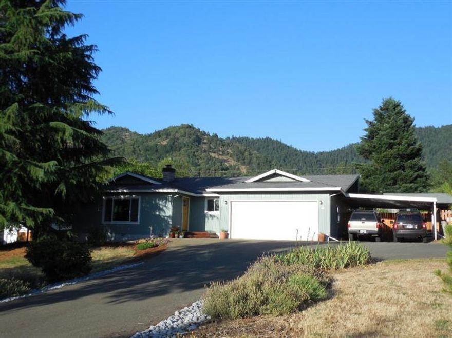 THIS IS A MUST SEE! Pride in ownership thru-out, and tastefully updated. This 1540 square foot three bedroom, two bath home on 1 semi- private park like acre with beautiful mountain scenery, close to town with low county taxes, two car garage, large attached car port, 26x30 shop w/office, fully fenced back yard, deck, hot tub, garden area, many fruit trees:two apple, peach, cherry, six walnut. Home has gorgeous concrete countertops, updated heat pump, windows, newer paint, carpet and flooring. You won't be disappointed! Don't let this one pass by. Call to see today.... All information deemed reliable but not verified nor guaranteed and subject to change without notice. Buyer to do own due diligence.