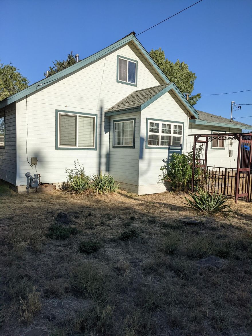 PLEASE READ SHOWING INSTRUCTIONS. 
 This is a must see!!! Master Garden with every vegetable you can imagine Video of Garden.  https://youtu.be/a9iYekPao2c  
 With room for horses on 2 acres.  New 30yr comp roof is going on now, newly remodeled bathroom.  Kitchen, floor, and furnace in the last 2 years.  Natural gas. Large 28x40 Insulated shop with a 16ftw x 9.9h door. Walk in cold room in the garage is 8x10.  Great porch with porch swing!! A must see.  Great location in town but feel like you're in the country.