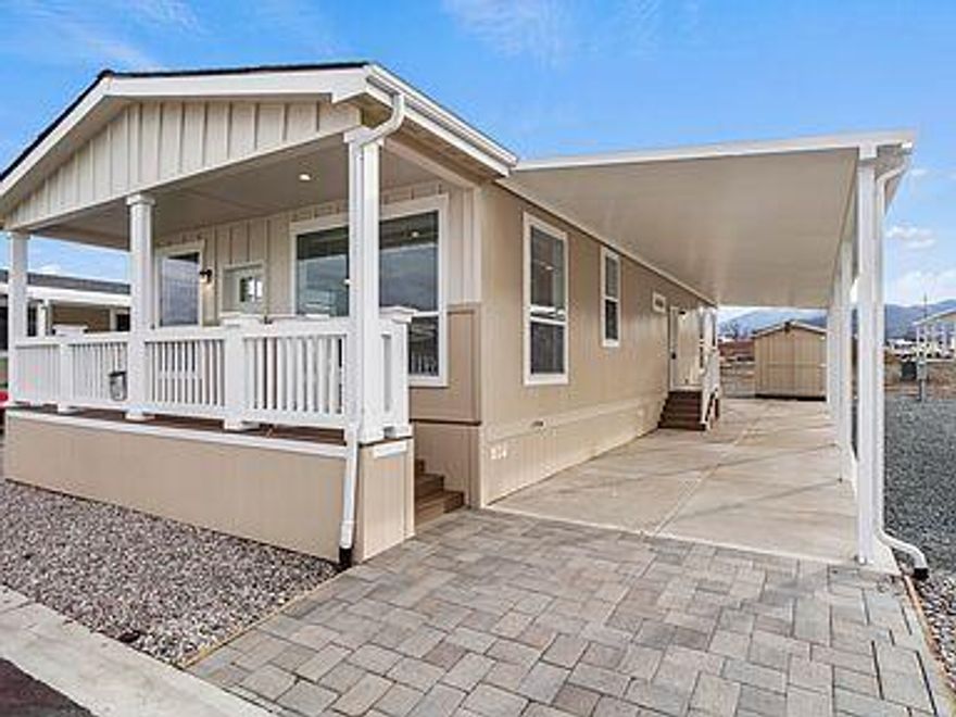 Welcome home to this 2021 built 3 bedroom, 2 bath home in an all age community.  Great open floor plan with vaulted ceilings, large living area, and a spacious laundry room. Bedrooms are nice sized with the primary having double vanities. The covered front porch is the perfect place to relax. The amenities provided really make it a great option for families. A private, fenced in park, a large, clean swimming pool and hot tub, and a fantastic gym & family friendly club house.   There is an outdoor BBQ and plenty of tables and chairs for summer gatherings. The dog park has obstacles to help keep your furry friend well exercised. The Bear Creek Green Way trail runs behind the community with a locked gate to keep non-residents out, it is perfect for family bike rides and leisurely walks to Lithia Fields or Blue Heron Park. Space rent $943, water, sewer and garbage is billed separately.