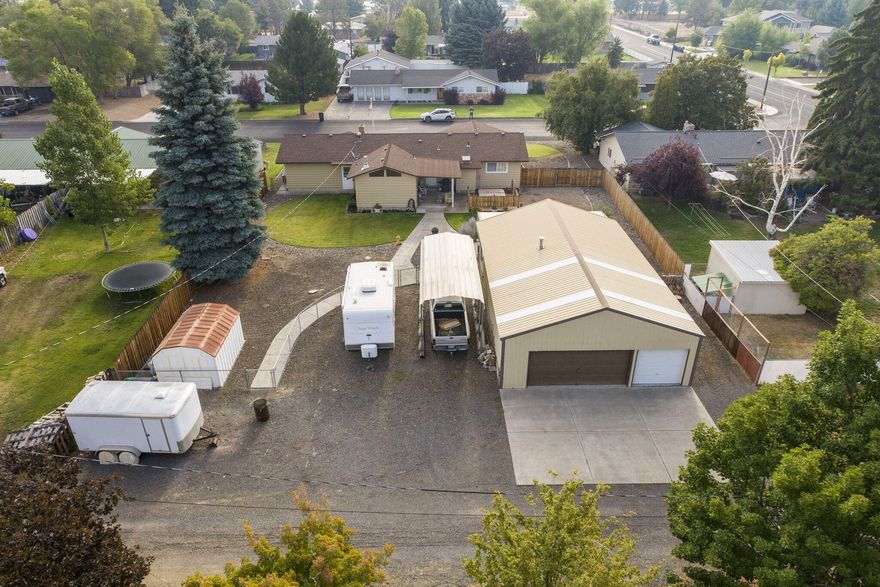 Single story home with HUGE 30'x48' shop! Home features a living room, family room, three spacious bedrooms and a finished 2-car garage. Property is beautifully landscaped with a private oasis setting in the backyard and has ample parking to store all your toys. Don't wait - this one won't last!