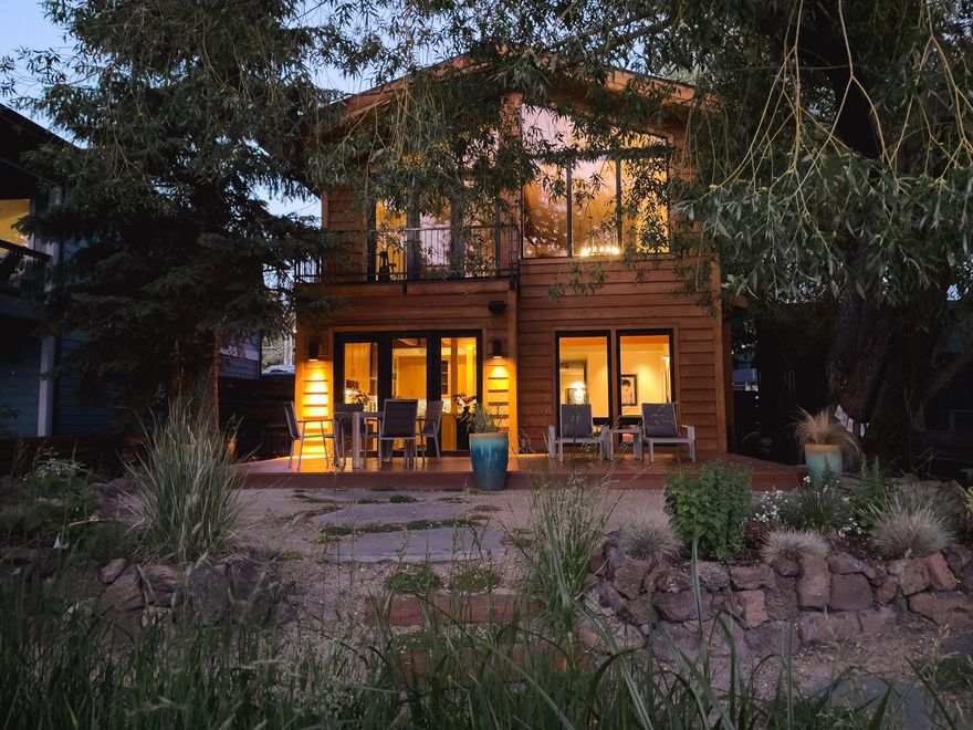 Nearly 4000 SF of modern contemporary living space. Situated on Bend's highly sought after Riverfront St., this home is an entertainer's dream. Walk into an open floor plan, floor to vaulted ceiling windows, chef's kitchen, radiant floor heating, media room,
master on the main and upper, solar power/water, and countless more amenities. Step out the back door to abundant wildlife along the Deschutes river,
pristine landscaping, a newly updated cedar patio, and a private dock where you can catch glorious sunsets.