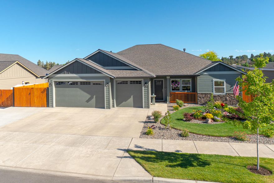 Don't miss! Located on the Bend side of Redmond w/Cascade Mtn Views. Spacious living both inside & out, w/plenty of room for entertaining. Vaulted Great Room plan w/open Kitchen, tons of cabinetry & prep space on the slab Quartz counters. Neat & tidy full height tiled back splash, SS appliances, & farm sink. Living space offers a cozy Gas burning fireplace w/stylish accents, top down bottom up cellular blinds,  & room for gathering. Desirable Primary separation, walk in closet, soaking corner tub, step in shower, tiled floors & dual vanities. 2 additional guest rooms w/full bath. Laundry room w/storage & folding table too! Durable wood look laminate flooring, carpet in the bedrooms & tiled baths. Gas forced air, A/C, solar tube & large covered back patio area. Triple car garage w/epoxy floors, 8x12 hickory shed, fully fenced, professionally landscaped w/auto sprinklers, RV Parking + 30amp power!