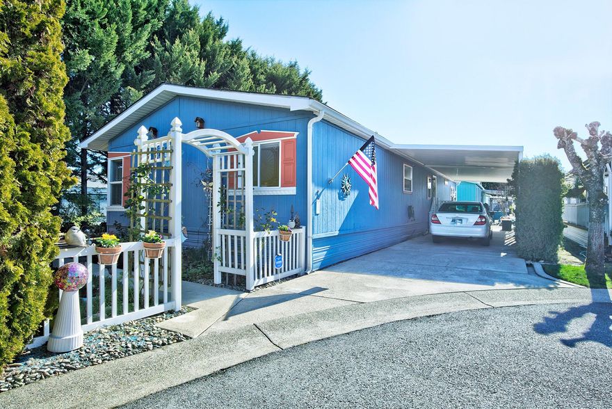 Meticulously maintained 1782 SF, 3bed, 2bath Manufactured Home w/split open floor plan that is tucked privately at end of cul-de-sac in Willow Estates S. 55+. Lg updated kitchen boasts newer appliances, eat-in island, wood cabinets, pull out shelving, lg skylight, and pantry. Upgraded laminate flooring in the living area w/plush carpet in the bdrms, vaulted ceilings w/plant shelves, woodstove, ceiling fans, vinyl windows, heat pump, & so much more. Spacious primary bdrm has dual walk-in closets & a lrg bathroom w/double vanity & oversized soaking tub. The ample 2nd & 3rd  bdrms each have walk-in closets. Enter through private landscaped yard equipped w/timed sprinklers & drip irrigation that leads to the lrg deck & frnt door or through the backdoor, off the triple length carport into the laundry rm/ office/craft area.  This home w/ a 4-year-old roof & newer exterior paint includes a 6x20ft workshop/storage shed equipped w/power & raised garden beds. This beautiful home is move-in ready