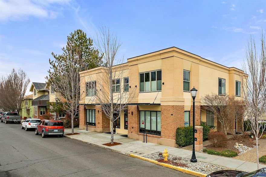 Rare opportunity to own a gorgeous and newer commercial building in the sought after railroad district. The penthouse apartment is over 3,300 + SF and features three bedrooms and three bathrooms. Gorgeous hardwood and tile floors accent the primary living areas and carpet accents the bedrooms. Gourmet kitchen with lots of cabinets, stainless appliances, granite countertops and island with breakfast bar. Light filled great room with incredible views of Grizzly Peak and direct access to the oversized balcony. Spacious rooms, elevator, two car garage and more. Ground level has two commercial spaces with long term tenants. Flexible floor plan. Six addtn'l off-street parking spots plus an attached two car garage. Don't miss this amazing property.