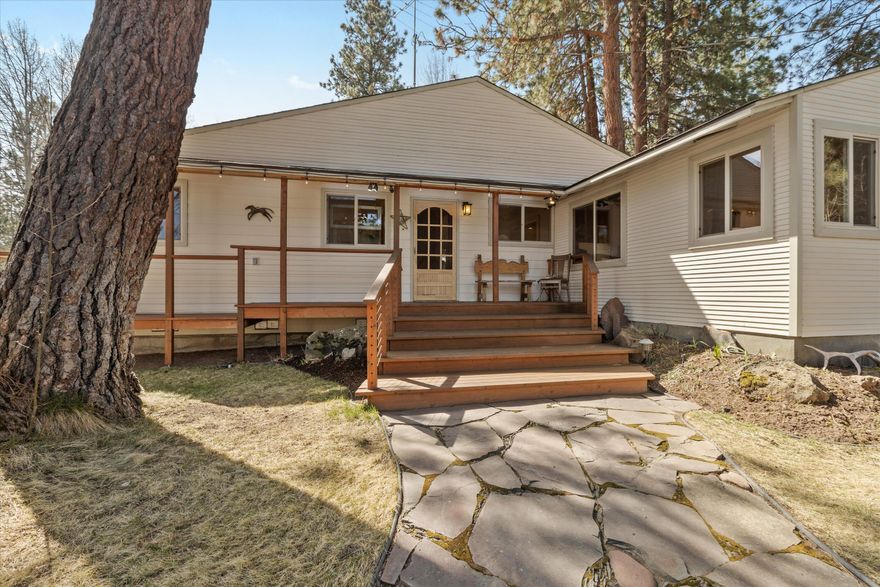 One level approx 2160 sq ft impeccably maintained home completely updated the past few years. Large covered wrap around deck. 4 year old 50 roof, 2 year old new kitchen appliances Wood Floors  All countertops, floors and cabinets have been replaced or updated.  Hot Tub & Sauna.  7.12 magical  very private fenced & cross fenced acres w/automatic irrigation system. Large pond, 60' round pen and arena. 30 X 36 hand hewn BARN with large hay loft, tack room & stalls  30 X 36 SHOP/GARAGE with 10 foot doors plus covered attached RV storage. Shop garage also has separate storage area for motorcycles or snowmobiles etc. Plus a 7 X 15 bonus studio/ office attached to the shop with its own private exterior stairway entrance. Fenced garden  Home is located on a quiet dead end private country street and small neighborhood but only approx 10 minutes to shopping, schools and services.  Horse lover? or do you like to run/walk, bike?  Neighborhood access to the Nat Forest  A little slice of heaven