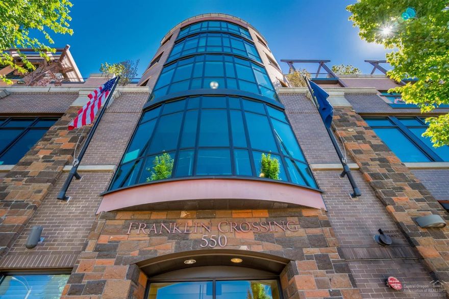 Imagine urban living in the quaint mountain town of Bend, OR. This 2006 Franklin Crossing penthouse condo is in the center of it all, sleeps 4, & comes fully furnished & in immaculate condition w/ views of Pilot Butte, Paulina Peak & the city. High end finishes include bamboo, travertine & granite surfaces & stainless Dacor & Kitchenaid appliances. 10'x7' Storage Rm on same level & steps away. Ski locker near corner parking space. Walk to fine dining, shopping, theater, galleries & music in the park.