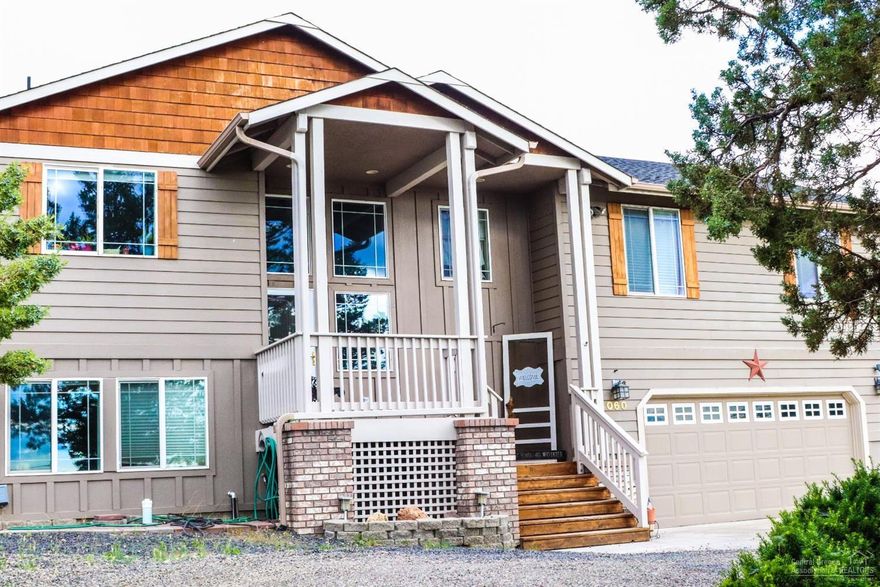 Great Barnes Butte and Cascade mountain views from this spacious home on half acre lot in North Ridge. You will love all the space in this 2680 square foot home, featuring 4 bedrooms and 3 baths. Updated kitchen with tile back splash, stainless appliances and views of the Cascade Mountains. Great room floor plan with wood stove for our Central Oregon fall season. French doors off the back lead to a large covered deck looking out to the Barnes Butte. Master suite with double sinks, soaking tub, walk-in shower and walk-in closet. Master has door out to back deck as well. Down stairs you will find a large bonus room (that is being used as the 4th bedroom) and bathroom. Don't forget to bring your toys, with the over sized double garage and plenty of room to park the RV or build a shop. Great park just up the road.