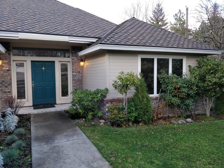 Light-filled custom home with beautiful mountain views. Spacious cook's kitchen with island, granite countertops, and abundant storage. Living room features gas fireplace, built-in bookshelves, and recessed lighting. Stately main-floor primary bedroom with large en-suite bath and soaking tub. Two downstairs bedrooms with a recreation room and patio. Downstairs is plumbed for a possible kitchen. Upper and lower two-car garages. Plenty of room for a workshop. New heating system and a hot water heater.