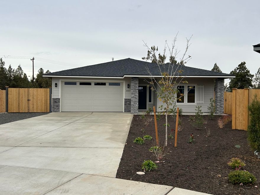 Lot 21 features the Tundra floorplan w/ contemporary NW design. Nearly completed -estimated completion mid September. Single level living with 3 bdrms, 2 full baths and 2 car garage. Extensive separation between primary bdrm (w/ large walk-in closet & double vanity) & 2 guest bedrooms w/full bathroom. Entertain in your kitchen w/ SS appliances, pantry, full height tiled backsplash, extensive slab quartz countertops, large island opening to great room w/ decorative gas burning fireplace. Durable laminate plank flooring thru-out & carpeted bdrms. Utility/laundry room too. Fenced backyard & landscaping w/ sprinklers, sideyard RV/BOAT PARKING w/ entrance gate. Korbin Meadows is a new community in desirable neighborhood of SW Redmond featuring Cascade Mtn views. *Floorplan  subject to change. Interior photos of home w/ similar floorplan. Interior color package may differ. Pro photos coming soon.