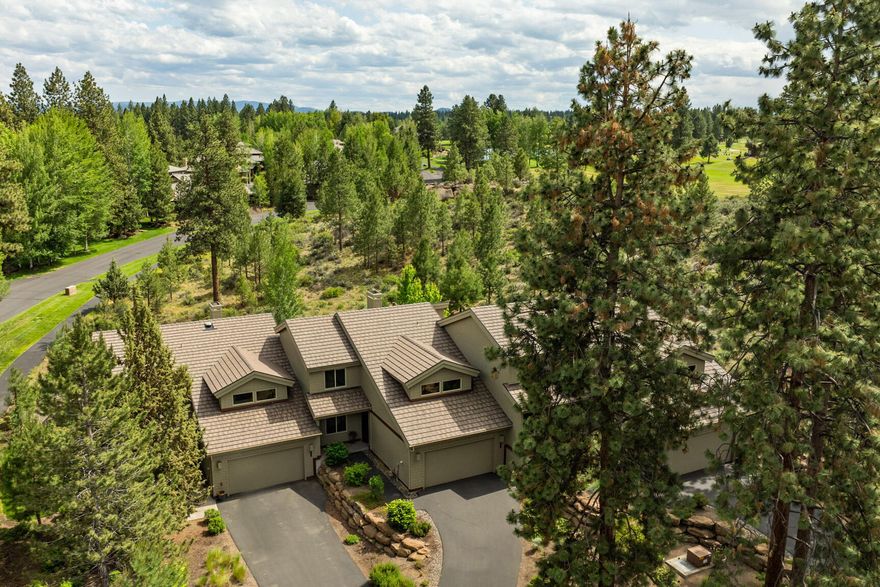 Set within the gated golf community of Broken Top, this Painted Ridge townhome offers refined living surrounded by the beauty of Central Oregon. Minutes from downtown Bend and close to Mt. Bachelor, high mountain lakes, and miles of trails, it's a home designed for both comfort and adventure. The vaulted great room features hardwood floors and a chef's kitchen with granite counters, a spacious island, and high end appliances. The main level includes primary and guest suites with California Closets, while the upper level adds a third en suite bedroom and a versatile bonus room with wet bar and full bath. Dual zone HVAC with commercial grade air filtration provides year round comfort. A covered patio opens to natural landscaping and peaceful open space, creating a quiet retreat within one of Bend's most popular communities.