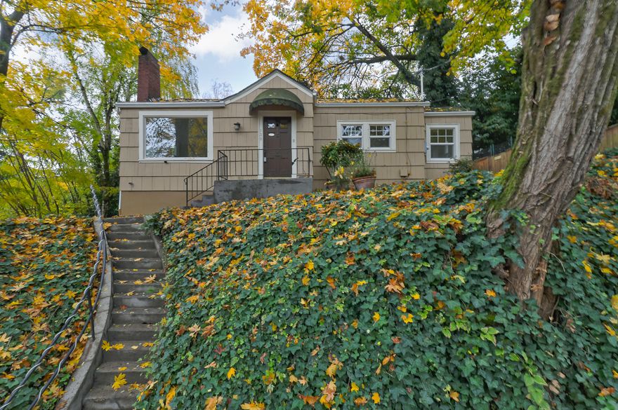 Remodeled Lair Hill Home on a Full Size .11 Acre Lot. Charming living room with fireplace, hardwoods, coved ceiling. Dining nook with French doors. Modern kitchen with updated cabinets, appliances, glass panel door to deck. Full bedroom, remodeled bath on main. Two bedrooms and full remodeled bath down, plus storage and laundry room. Detached garage. Don't miss the patio with fantastic views! Close to OHSU, South Waterfront, and Johns Landing Restaurants, Boat Ramp. Click Vtour for 3D walkthru. HES: 8