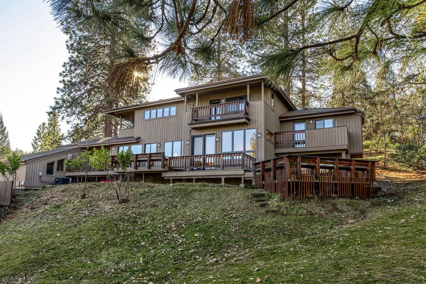 Spacious, well-built home in tranquil, natural setting in an established neighborhood above SOU. Built in 1989; this 3 bedroom, 4 bathroom home maximizes the views and has a delightful tree-house feel. A unique and functional layout with lots of good light, and separation of space. Multiple decks, roomy cook's kitchen and oversize office with skylight. Primary bedroom has an adjacent screened-in porch and updated en suite. Furnace, A/C and roof have been updated.