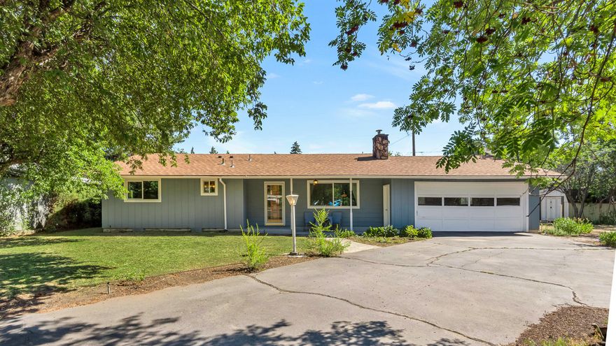 This midtown charmer is full of opportunity, with tons of the work already completed for you. Boasting over a quarter-acre lot, this property features ample flat space for an amazing shop, RV parking, detached home office or ADU. The yard is truly unique with multiple fruit trees, outdoor fireplace and plenty of room to play. The classic ranch house lives comfortably with new vinyl windows, fresh interior and exterior paint, all new plumbing, new ceiling fans, new tiled bathrooms, new kitchen backsplash and new laminate in the bedrooms. The open concept living area is spacious and perfect for entertaining with the added ambiance from the wood burning stove. With an incredibly centralized location, just 2 miles from downtown Bend, 1 mile from Larkspur park and the Larkspur Trail around the corner, you can enjoy easy access to all of Bend's best amenities. Come make your mark on this Central Oregon gem.