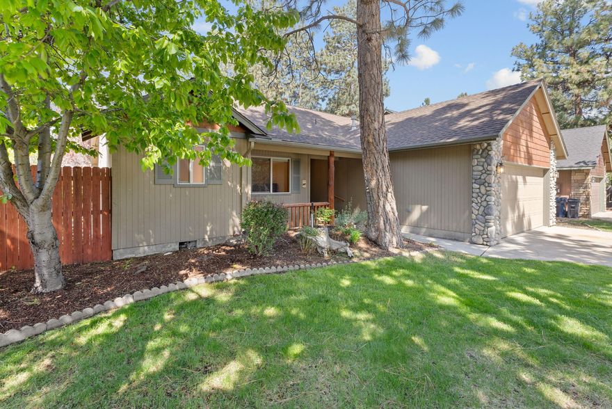 Charming single-level home in SW Bend's sought-after Quail Pine Estates neighborhood! Nestled on a beautifully landscaped 0.14-acre lot with mature Ponderosa pines, this 1,471 sq ft home offers 3 bedrooms and 2 full baths. The vaulted great room features a stunning wood beam ceiling, rock-surround gas fireplace, and beautiful oak wood floors. The open kitchen includes all appliances, an island, pantry, and solid wood cabinets. The private primary suite has a vaulted ceiling with a wood beam, walk-in closet, dual vanity, and walk-in shower. Additional highlights: Nest thermostat, cellular blinds, central gas heating & A/C, and gutters. Enjoy a separate laundry room with washer/dryer, utility sink, cabinets, and shelving. The fenced backyard includes a deck, sprinklers, and serene natural privacy. Two-car garage with shelving, attic storage, and man door. Covered front porch and full front yard sprinkler system. Located near trails, schools, and parks!