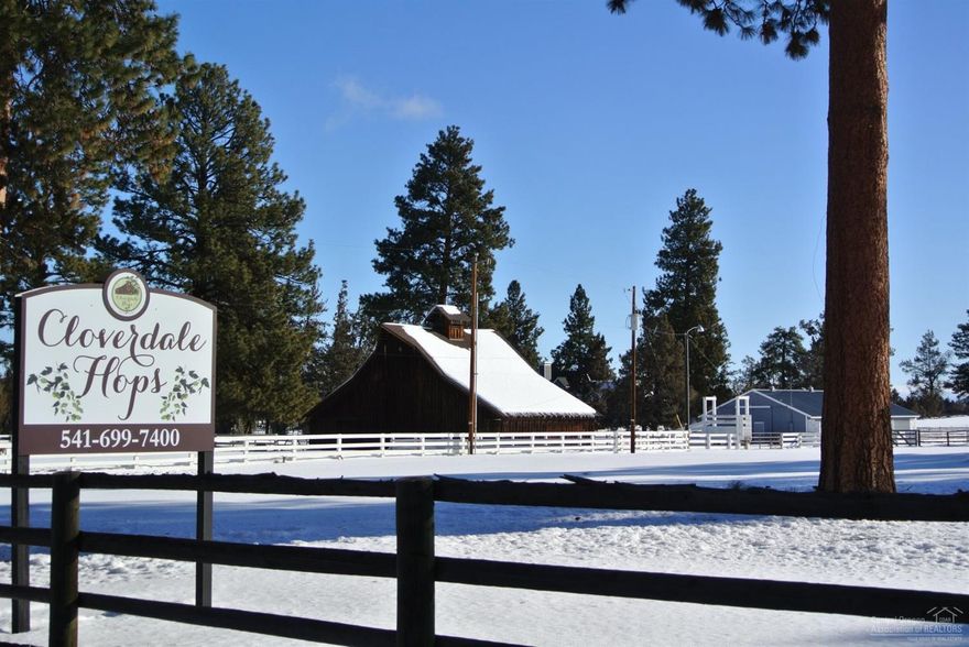 CLOVERDALE Ranch is for Sale! 20 acres,(16 irrigated), iconic Brown Barn, Cow Barn with 12 stalls, pastures, Pond, dry lots & small Hop operation in place. This Good-bones home, 3282+/- sq ft, has a main level master with 2 en-suites upstairs. vaulted living room with river rock Xtrordinaire fireplace, oak floors, half bath. Open kitchen has dining area complete with fireplace and sunroom with access to the deck. Large utility room is handy after a day with the horses! Country living, 5 miles to Sisters and 15 min to Bend. Partial mountain views, private.