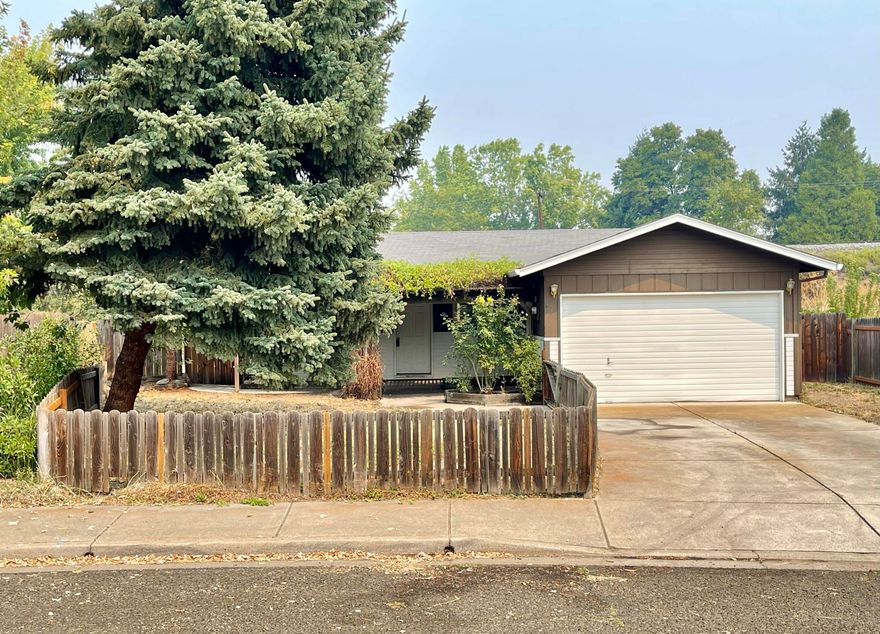$14,000 price reduction! 1993-built, single-level home in Talent on large .23-acre lot. 3 bedroom, 1 bathroom, 1,131+ sqft. Kitchen has an open breakfast bar out to living room. Kitchen & bathroom has laminate countertops, appliances included. Carpet, laminate wood and vinyl flooring throughout and vinyl double-paned windows. Spacious primary bedroom is large with built ins & walk in closet. This home has a very large level yard with the possibility of adding an ADU per City of Talent (buyer to do their own due-diligence). Fenced, w/gated RV or boat parking and a 6' x 8' shed. Covered front porch with arbor and sitting area. Close to schools.