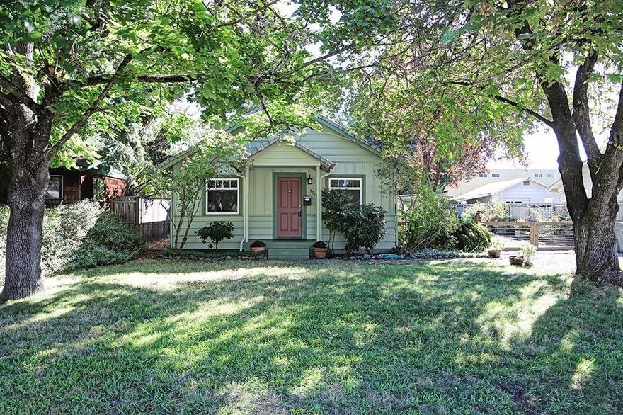 Charming 1920's cottage in NW Grants Pass is just waiting for you! With what looks like original floors but an updated kitchen, this is just 1308 sq/ft of adorable spread out over three bedrooms and a bath and a half. Upgrades include lots of tile, vinyl windows and a lovely back patio that you'll love spending time on. Shade trees frame the front yard and another graces the back providing cool summer evenings. Plenty to pick on this property with raspberries, blackberries and grapes along with a pear and apple tree. Come take a look!