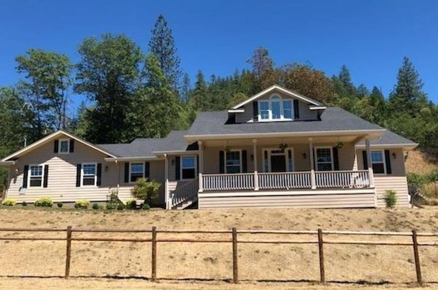 Custom Home with Lovely front porch and Views! This home and property have the WOW factor. Located in a prestigious Applegate Valley neighborhood and looking over thousands of treed acres this single level 3 bedroom, 2 bath home has the perfect combination of location, newer construction (2007) and very close to the Applegate River. West facing to take in those sunsets and only 10 minutes from town. The home features hardwood floors, new paint, French doors and a large cook's kitchen''. Room for the RV and/or boat. All information is deemed reliable but not verified; anyone considering purchasing this property should perform their own investigation into the uses and condition of the property.